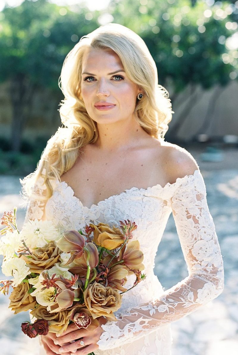 A close-up of the same guest on her wedding day — luminous, even skin