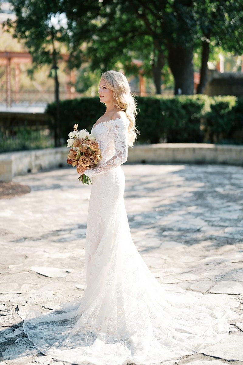 The welcome-page guest on her wedding day, in her gown with her bouquet