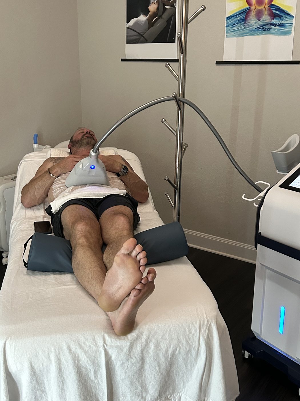 A male guest relaxed during his CoolSculpting session